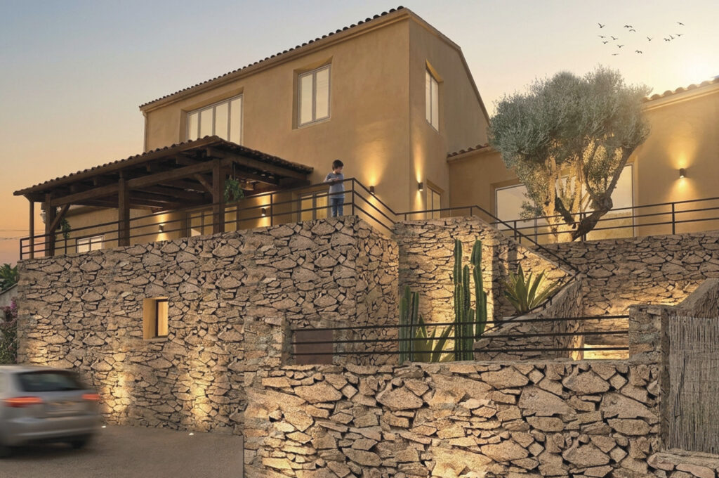 Villa contemporaine rénovée à Porto-Vecchio après extension de 89 m². Nouvelle entrée, murs en pierre, éclairage architectural, terrasses réaménagées et architecture intérieure haut de gamme valorisant les volumes et les matériaux.